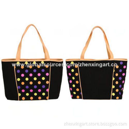 Black canvas handbag with colorful dots